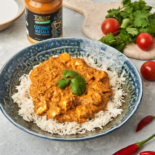 Coconut Masala Tofu Curry with Rice served in a bowl, garnished with fresh coriander