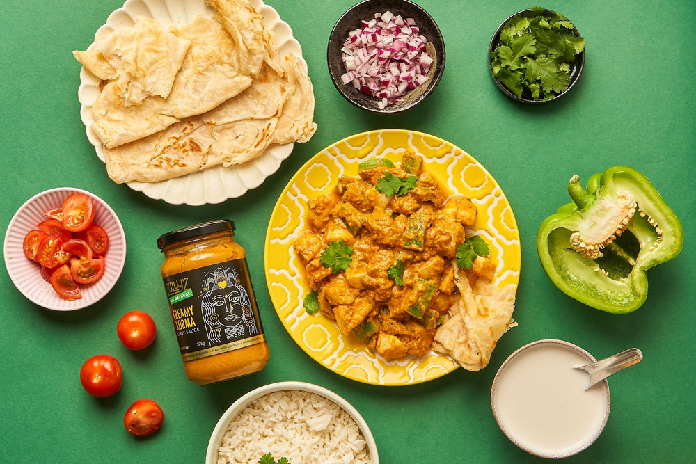 A bowl of Creamy Korma Curry with Potatoes and Capsicum, garnished with fresh coriander.